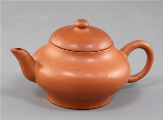 A small Chinese Yixing pottery teapot and cover, spout to handle 11cm